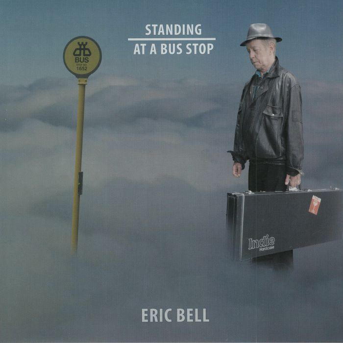 Eric Bell Standing At A Bus Stop
